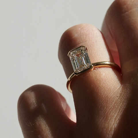 2 CT Emerald Shaped Half Bezel Lab Grown Diamond Engagement Ring