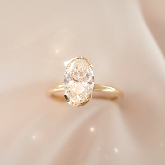 2.02 CT Oval Shaped Half Bezel Lab Grown Diamond Engagement Ring