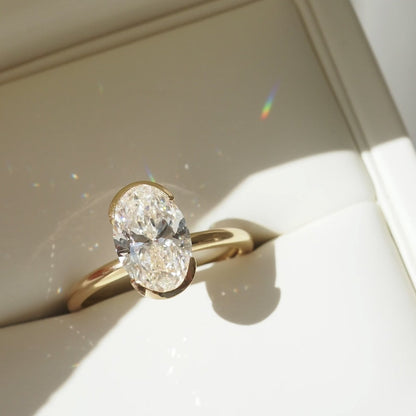 2.02 CT Oval Shaped Half Bezel Lab Grown Diamond Engagement Ring