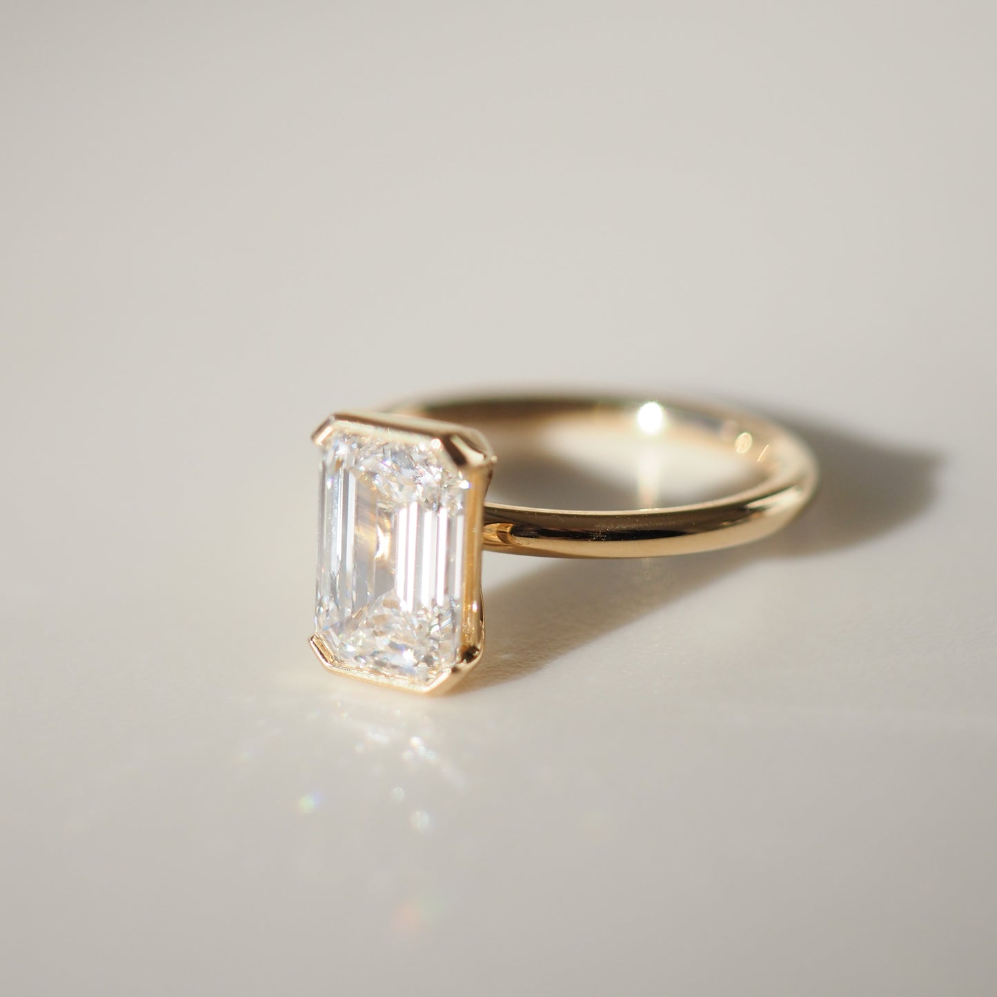 2.11 CT Emerald Shaped Half Bezel Lab Grown Diamond Engagement Ring